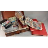 A large collection of British and world stamps to include The Victory Stamp Album and The Crown