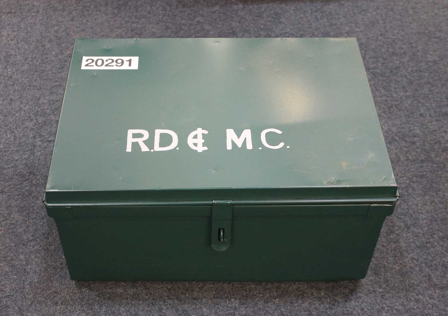 A green painted metal strongbox with side carry handles and painted initials to top, 57cm