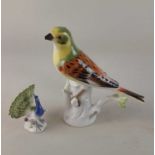 A small Meissen porcelain model of a peacock 6cm high, and a Meissen porcelain model of a