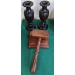 A large wooden gavel on block, together with a pair of turned wood vases