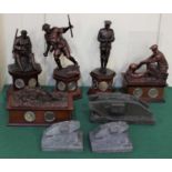 A collection of Danbury Mint commemorative First World War bronzed resin figures with coins,