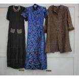 An embroidered blue short sleeved long coat, paisley coat and an early 20th century brown dress with