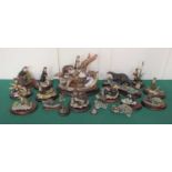 A collection of Border Fine Arts and Country Artists models of otters, some boxed