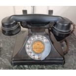 A British Bakelite telephone with chrome dial, 23cm