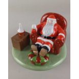 A Coalport Characters 'Raymond Briggs Father Christmas' limited edition figure 'Time for a break',