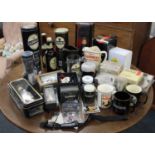A large collection of Guinness branded merchandise to include wristwatches, clocks, jugs, mugs,