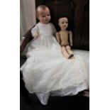 A Hugo Wiegand doll, with sleeping glass eyes and open mouth displaying two teeth, marked '702/