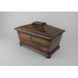 A 19th century rosewood tea caddy, of sarcophagus form, on bun feet, 31cm (a/f)