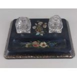 A papier mache and mother of pearl inset desk stand, with floral decoration, 23cm, with two glass