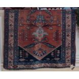 A Persian type rug, red ground, with floral geometric decoration within multiguard border 123cm by