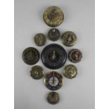 A collection of brass whist markers, some with finger pointer