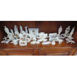 A collection of china crested ware ornaments, mostly military themed, to include one item of Goss,