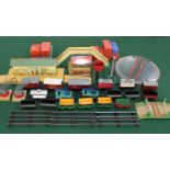 A collection of Hornby 0 gauge rolling stock, footbridge, signal station, station, signals, level