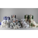 A collection of Staffordshire pottery style fireside spaniels (a/f)