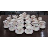 A Bilton's 'Womens Institute' china part tea service with WI monogram in maroon and green on white