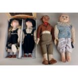 A cloth bodied doll dressed as a country gentleman with painted composite head 41cm high, and