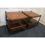 A pair of yew two tier ocassional tables square tops on baluster supports and castors, 56cm
