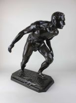 A bronze figure 'L'athlète' cast from a model by Ernest Bastin (Belgian 19th/20th century), the base