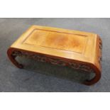 A Chinese hardwood opium / coffee table pierced frieze carved with fruiting vines on bracket