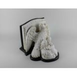 A ceramic eagle wall plinth on wooden mount 28cm wide