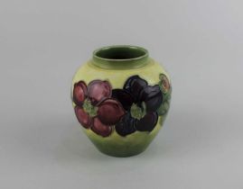 A Moorcroft pottery Clematis pattern vase, pale green ground, 10cm high