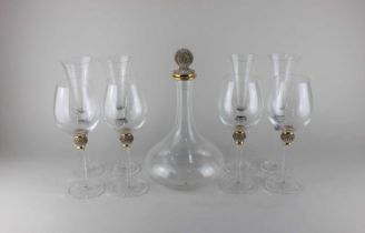 A glass decanter with diamante encrusted ball shaped stopper, together with a set of four matching