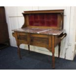 A Victorian wash stand with tile back and shelf, rectangular marble top over two cupboards with side