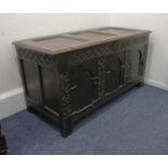 An 18th century oak coffer with blind fret three panel front, on block feet, 133cm