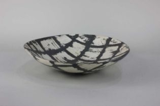 Carolyn Genders (b1957) a studio pottery dish with grey and grid pattern incised signature and