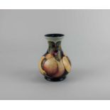 A Moorcroft pottery 'Mediterranean peaches' pattern baluster vase 16.5cm