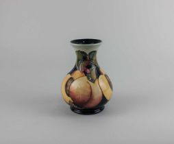 A Moorcroft pottery 'Mediterranean peaches' pattern baluster vase 16.5cm