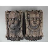 A pair of carved oak cherub mounts, by repute from The Old Vicarage Goodrich, Herefordshire, 35cm by