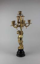 A gilt five branch candelabra, the stem modelled as a putto, 59cm high including base (a/f)