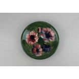 A Moorcroft pottery Anemone pattern plate, green ground, 21.5cm
