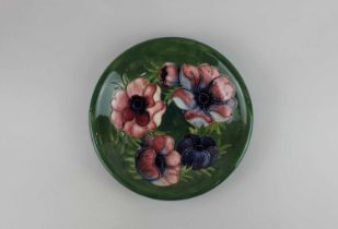 A Moorcroft pottery Anemone pattern plate, green ground, 21.5cm