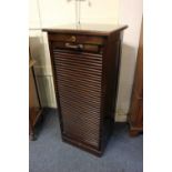 An oak tambour fronted filing cabinet with nine drawers, plaque verso for Cookes (Finsbury) Ltd,