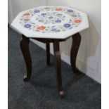 A modern hexagonal occasional table with floral designed top, 43cm
