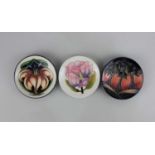 Three Moorcroft pottery trinket dishes in New Forest, Hibiscus and Lily patterns