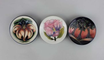 Three Moorcroft pottery trinket dishes in New Forest, Hibiscus and Lily patterns