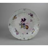 A Meissen porcelain dish decorated with flowers on white ground 34.5cm diameter (a/f - restored)