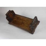 A Victorian rosewood carved bookstand by Daniel Ruddle March 1873, with inlaid lettering 'TRUTH',