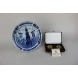 A Delft commemorative plate for the Olympics, Amsterdam 1928, together with a cased set of two