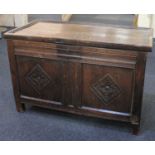 An 18th century small oak coffer with two carved panelled front on block feet, (a/f) 85cm