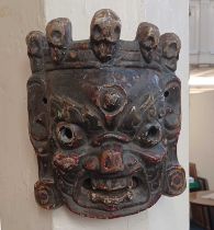 A carved and painted wood Eastern face mask (a/f)