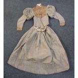 A 19th century brown silk two piece lady's day dress, the jacket with patterned front panel and