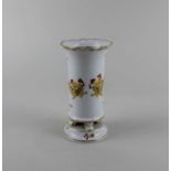 A Meissen porcelain vase decorated with yellow dragons and bird on white ground 14cm high