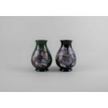 Two small Moorcroft pottery vases in Clematis pattern on blue ground 10cm, and Anemone pattern on