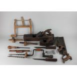 A small collection of woodworking tools to include handsaws, wooden block planes, brace drill, bits,