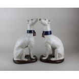 A pair of majolica greyhounds, possibly Italian, 36cm high (a/f - one with small chip to ear)