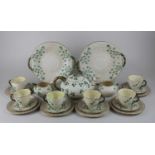A Belleek porcelain part tea service decorated in the shamrock pattern, comprising teapot, sugar